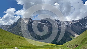 Green rocky slopes of the northern Elbrus region. Aerial view of a beautiful mountain summer landscape.