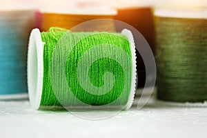 The green roll of thread on background,needlework,craft,sewing