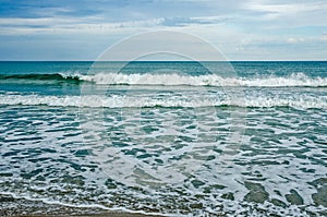 Green Rolling Waves and White Frisky Waves