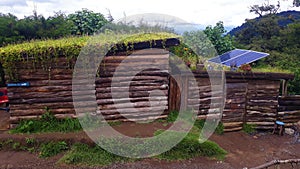 Green roof and solar panels. Environmental green energy and sustainable construction