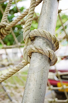 Green rope on iron pole