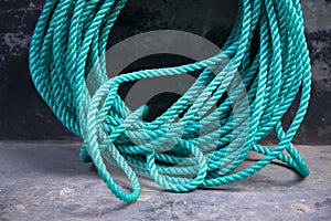 green rope tied up on the dock of the ship