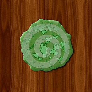 Green rotten slime on wood background