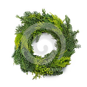 Green round Christmas wreath isolated on white background