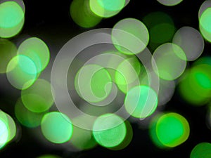 green round glowing bright light abstract lights on a black background