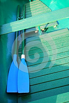 Green Rowboat with blue Oars