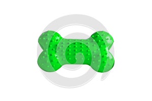 Green rubber dog`s bone isolated on white background, puppy dog toy imitated bones for relax with chewing, close up