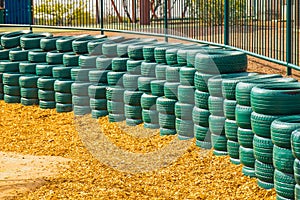 Green Rubber Tires Used As Bumpers For Small Children at Desert photo