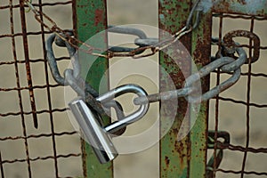green rusted locked gate