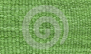 Green rustic fabric texture. Closeup of rough canvas for bright and rustic background