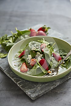 Green salad with feta and strawberries