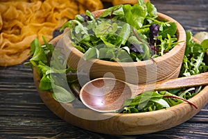 Green salad leaves antioxidant ingredient in a plate organic a wooden background