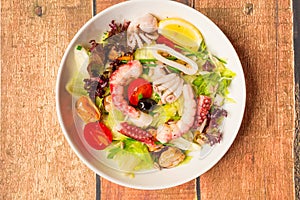 Green salad with sea food ingredients.