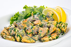 Green salad with sea food ingredients. Fried Mussels