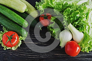 Green salad, tomatoes, cucumbers, zucchini, squash, and onion