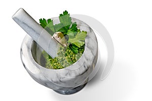 Green sauce in marble mortar and pestle