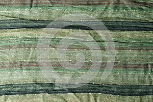 Green scarf fabric with stripes texture, background