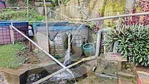 green scenery with a round pond for fish farming