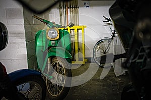 green scooter in a parkinglot