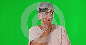 Green screen, anxiety and senior woman bite nails for worry, fear and scared expression in studio. Stress, phobia mockup