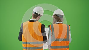 Green Screen Back View Young Male and Female Civil Engineers Modern Construction