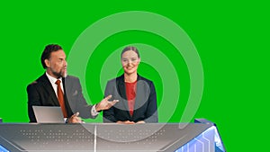 Green Screen Background: Live News Studio with Beautiful Female and Handsome Male Anchors Reportin