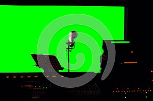 Green screen background at recording studio.