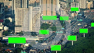 Green screen billboards in city landscape