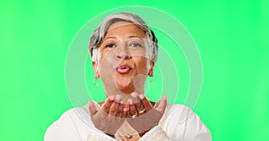 Green screen, blow kiss and face of old woman with happiness, confident and smile on studio background. Portrait of