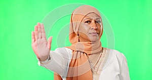 Green screen, hand and stop by muslim woman face in studio for warning, order or ban on mockup background. Palm, protest