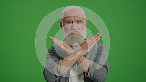 Green Screen.An Old Man Shows a Prohibition and Stop Sign.