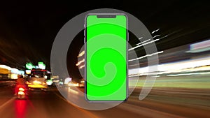 Green Screen Phone Against Neon Highway Lights, Motion Concept in City at Night