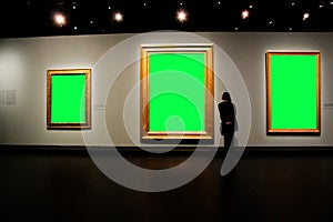 Green screen photo frame that displays large images in the museum with the audience walking