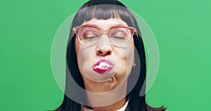 Green screen, portrait of woman with marshmallow in mouth, full of food. Hungry or starving, weight gain or addiction