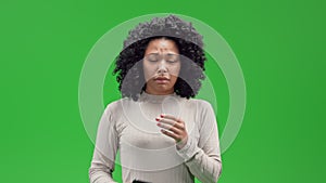 Green Screen young african female using mobile shows feel disappointment