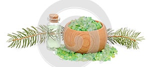 Green sea salt for bathing in wooden bowl and spruce branches be