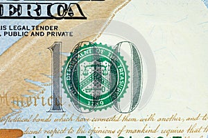 The green seal on one-hundred-dollar represents the U.S. Department of the Treasury.