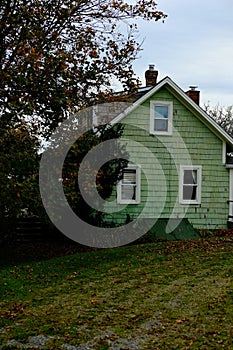 green seaside cottage in new england - nautical architecture home vintage old fashioned house