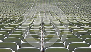 green seats in a sports facility without people