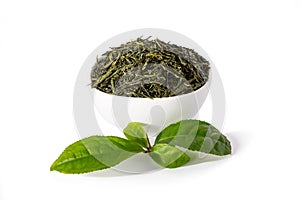 Green sencha tea in white cup with tealeaves
