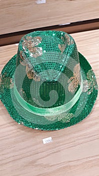 Green sequined holiday top-hat for St. Patricks Day with silver sequin shamrocks
