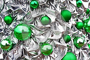 Green shiny xmas balls on crumpled background