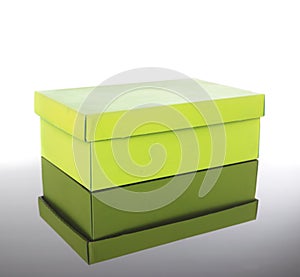 green shoe box reflective black floor