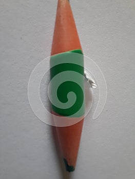 Green short pencil that is sharpened on both sides, bullet shaped