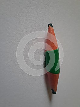 Green short pencil that is sharpened on both sides, bullet shaped