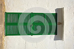 Green shuttered door