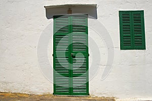 Green shuttered door & window photo