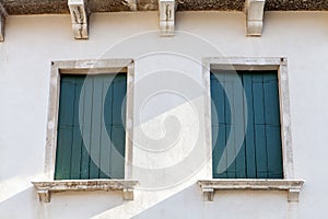 Green shutters in Venice Italy