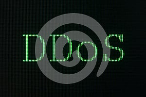 Green sign of DDoS, Distributed Denial of Service, displayed on computer screen