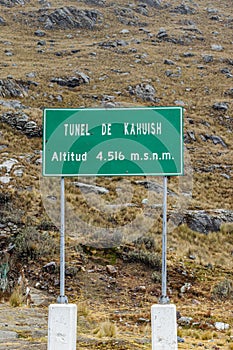 Green sign indicating the Tunel de Kahuish, altitude 4.516 masl. In the highway ChavÃ­n de Huantar-San Marcos